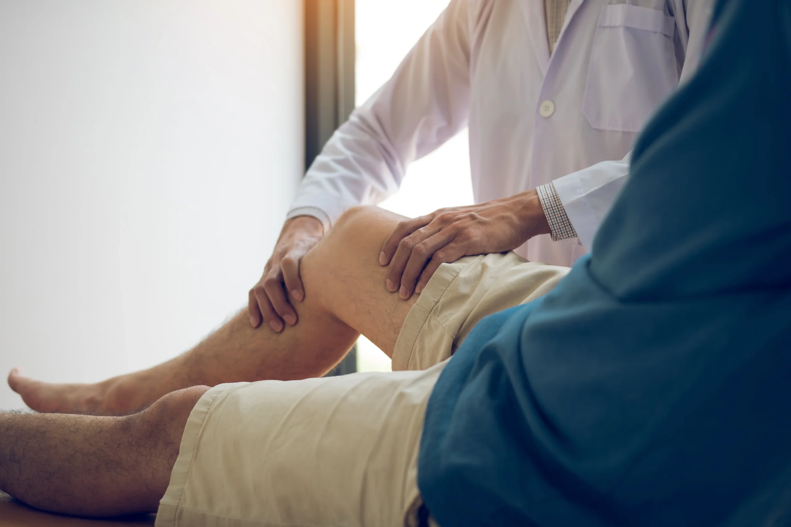 Vascular specialist reviewing knee imaging before GAE embolization procedure